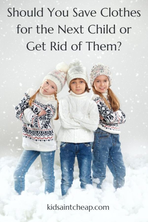 Three kids in winter outfits in a snowy landscape