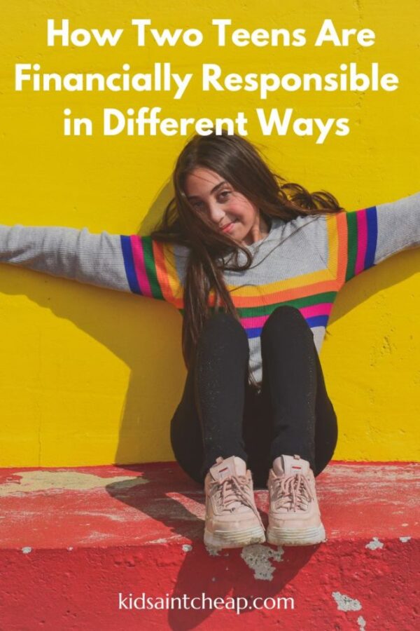 Teen girl with her arms stretched out standing in front of a yellow wall.