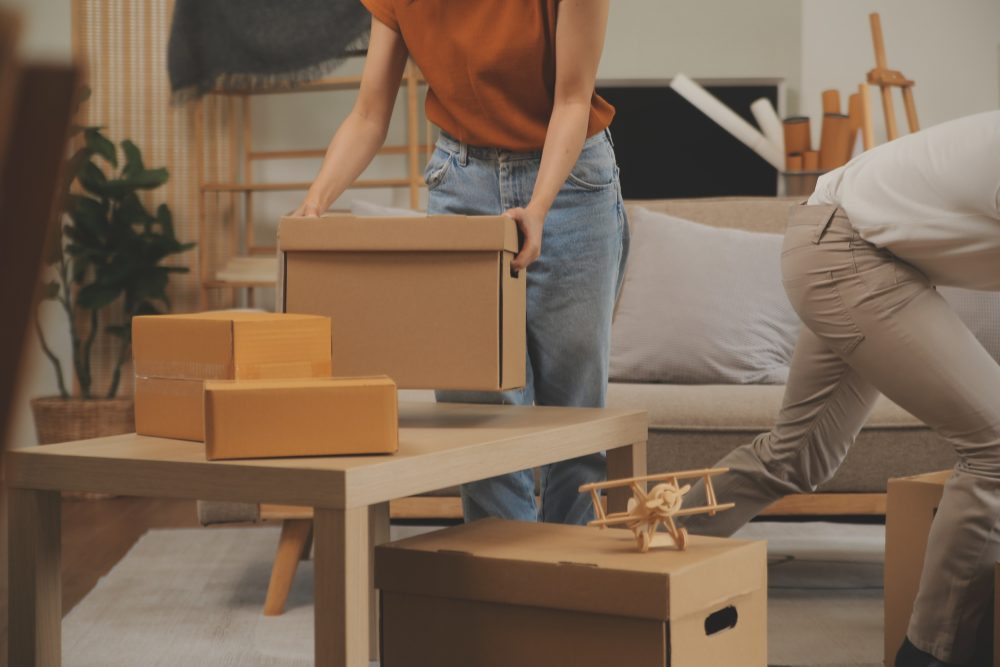 Man and woman packing up boxes