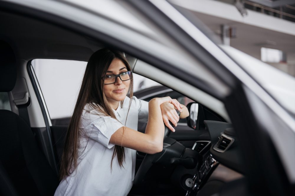 Female teen driver behind the wheel