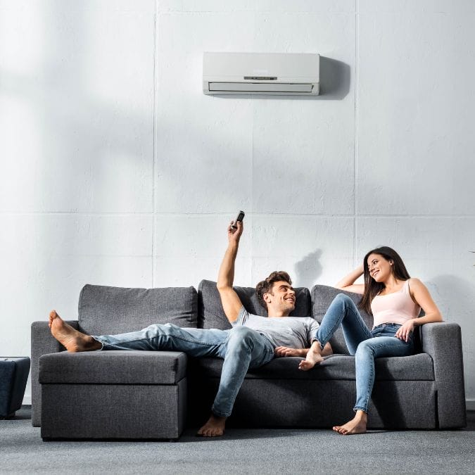 a couple cooling down with an aircon