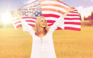 a woman holding the american flag