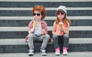 photo of two cute hipsters eating icecream