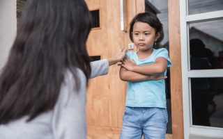 mother rebuking a little child for bad behavior. scolding her daughter