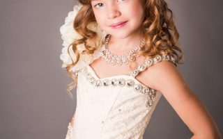Beautiful little girl in a dress posing