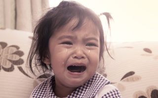 cute little girl is crying