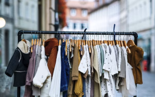 Parent picking out free clothes for a child