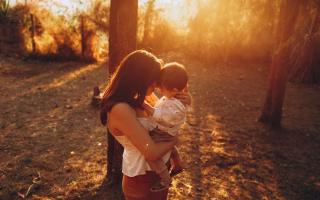 Mother reflecting on life before parenting