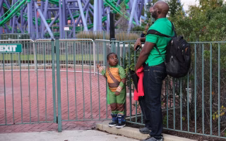Dad casually parenting while receiving praise