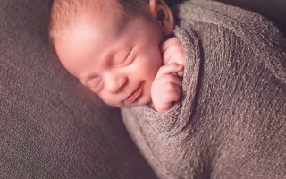Trendy baby lying down, capturing modern name vibes