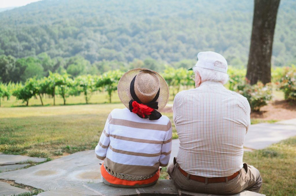 grandparents sitting outside together