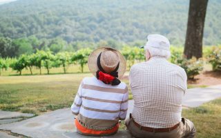 grandparents sitting outside together