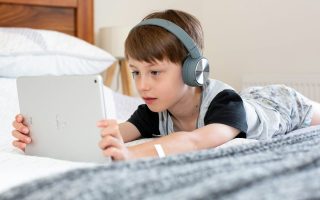 child looking at ipad
