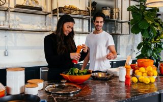 young couple cooking together