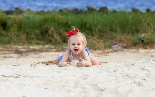 happy little girl at the beach