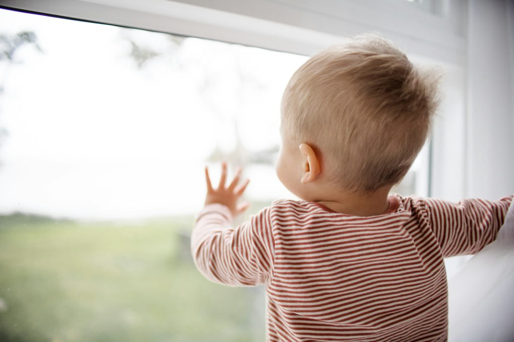 baby looking out window