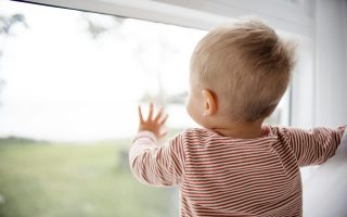 baby looking out window