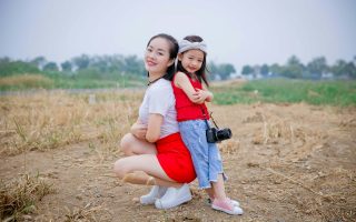 parent and child with camera