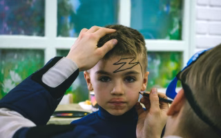 Child getting face paint, symbolizing efforts to address misbehavior in school.