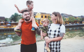 Family playing together in a park.