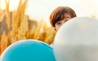 curious child with ball