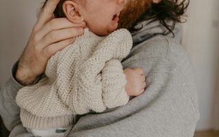 dad comforting crying baby
