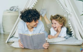 smiling parent with child