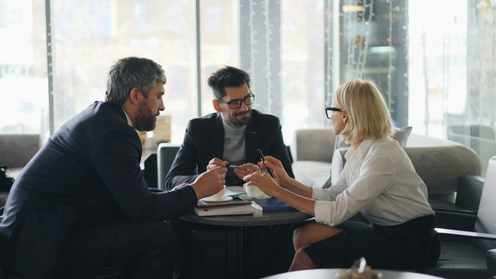 professional-looking team meeting over coffee