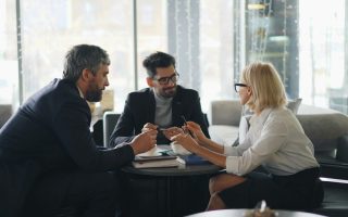 professional-looking team meeting over coffee