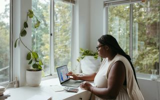 woman working on laptop in home office