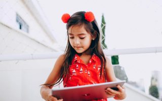 Young Girl On Tablet