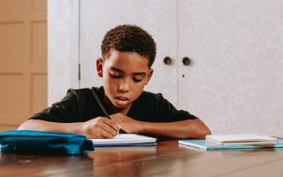 Young Boy Studying