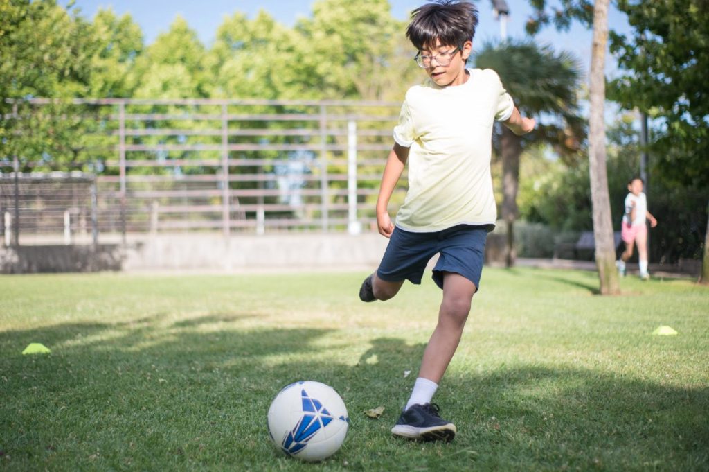 Child Playing Soccer