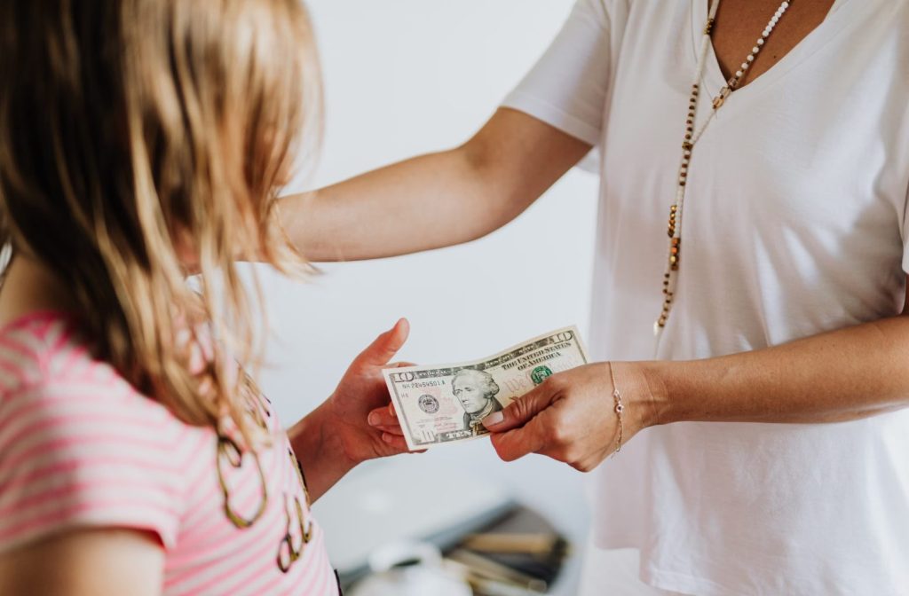 Parent Giving Kid Money
