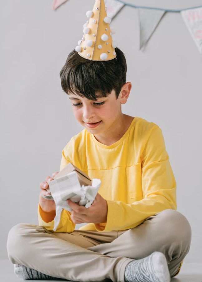 Young Boy Opening Gift