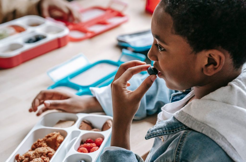 Young Boy Eating Lunch
