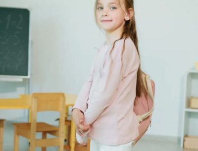 Young Girl Wearing Backpack