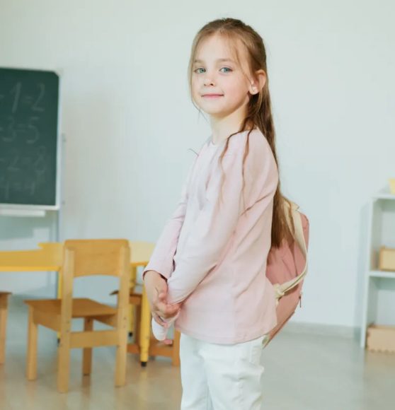 Young Girl Wearing Backpack