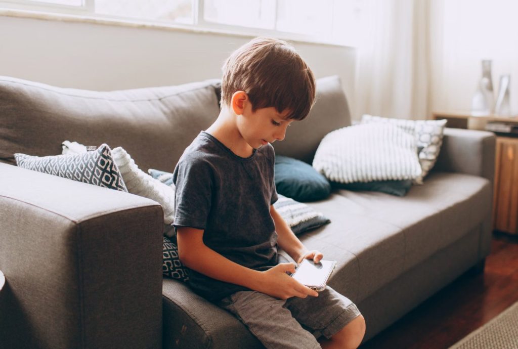 Young Boy Using Smartphone